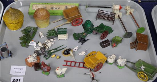A collection of mostly Britains farmyard accessories, rabbits, cats, chickens and ducks, etc.